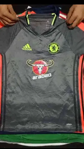 Football club T-shirt.